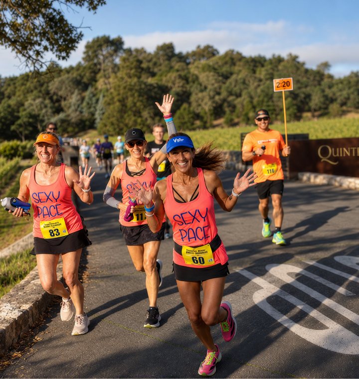 Runners smiling on the road out of Quintessa